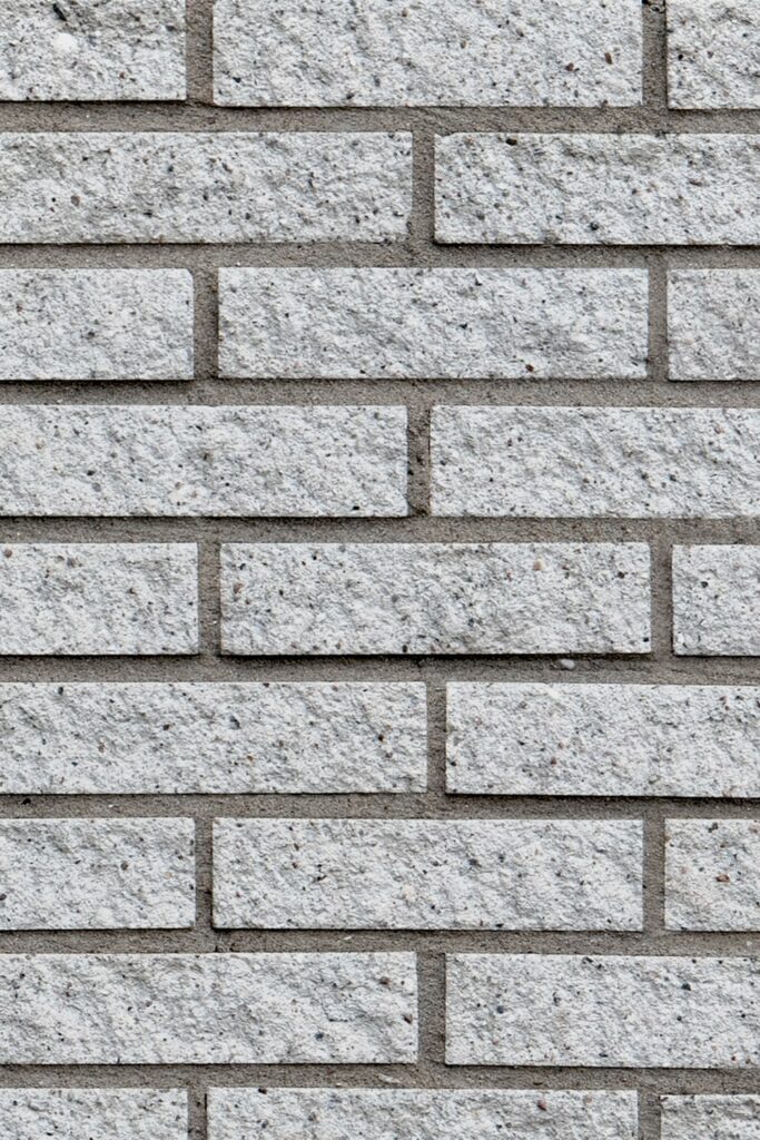 White stonelike decorative brick wall close-up