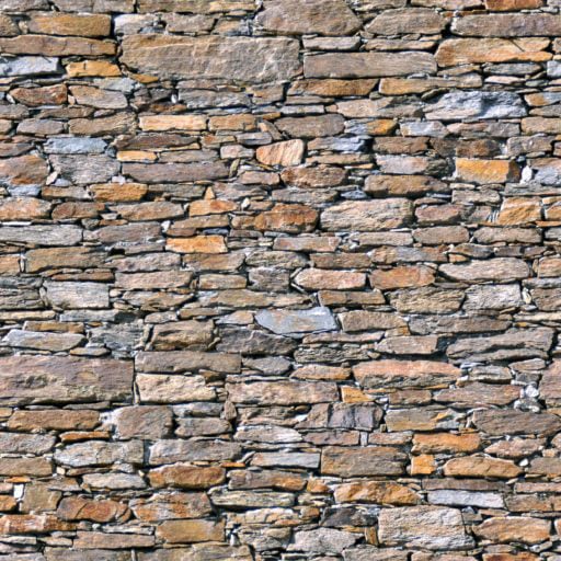 Multicoloured wall with irregular stones