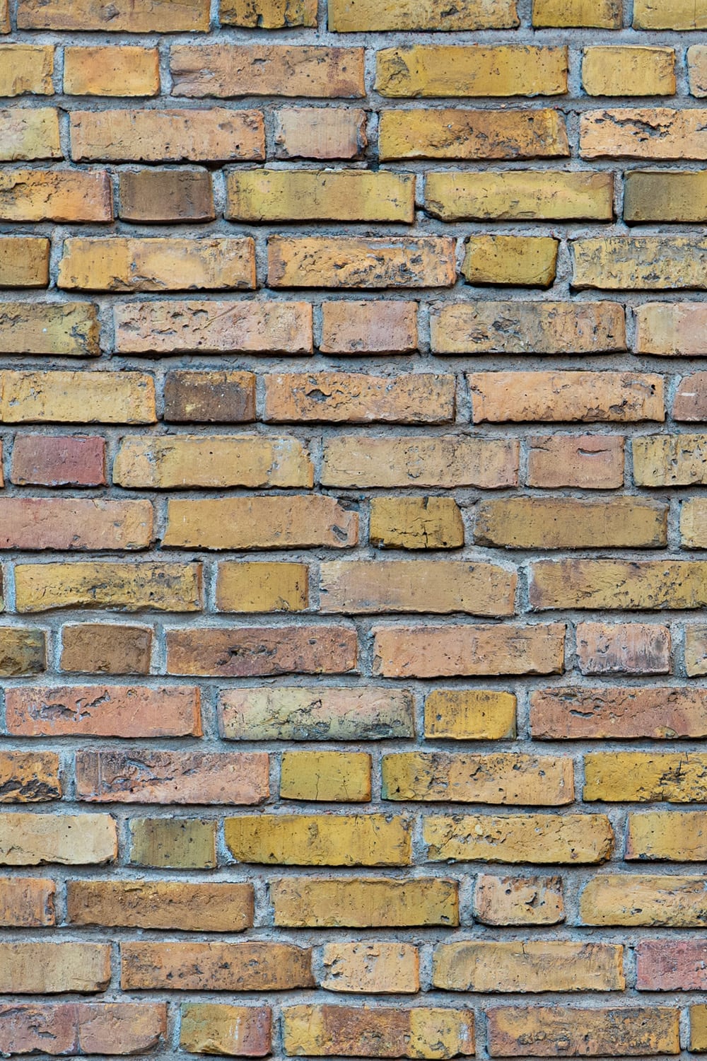 Ochre brick wall close up