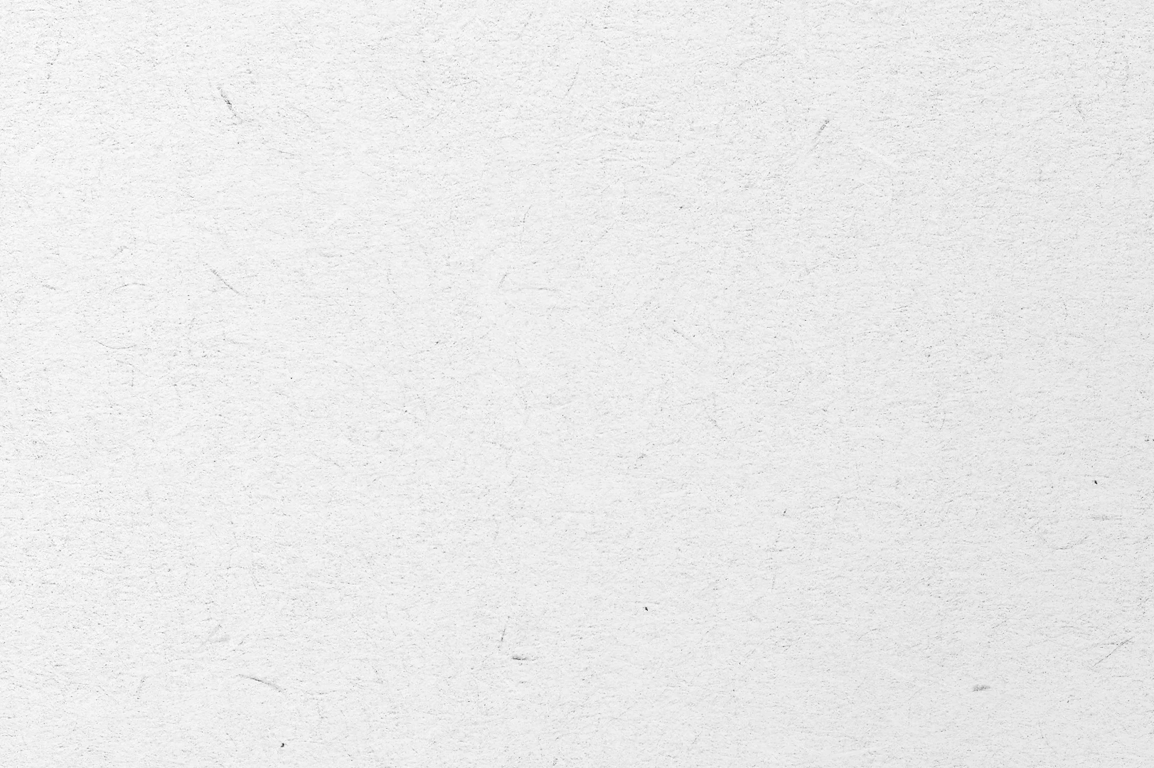 Close-up of a soft handmade paper with subtle specks