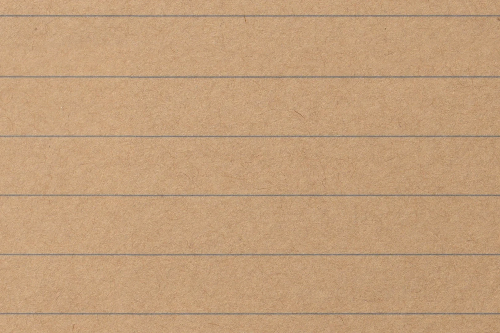 Close-up of a ruled ochre notepad paper