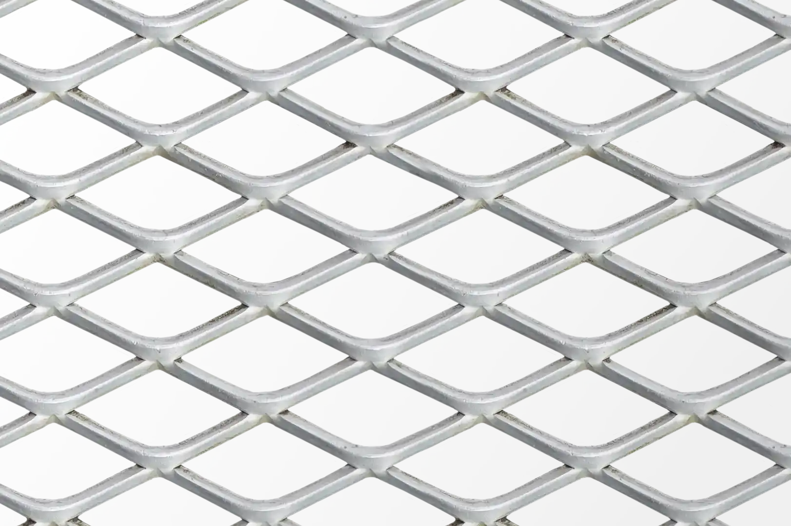 Close-up of a thick stretched metal mesh fence