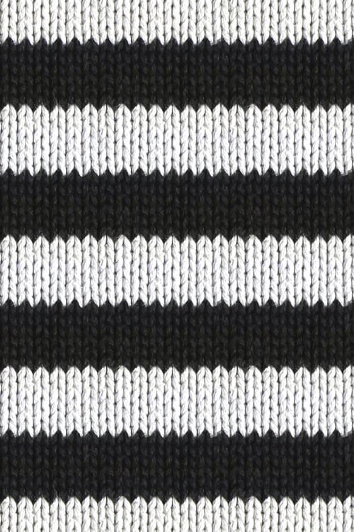 Close-up of a knitted polyester pullover with black and white horizontal stripes