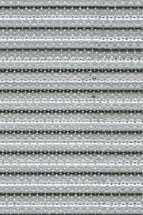 Smooth Undulating Perforated Metal Sliding Shopfront