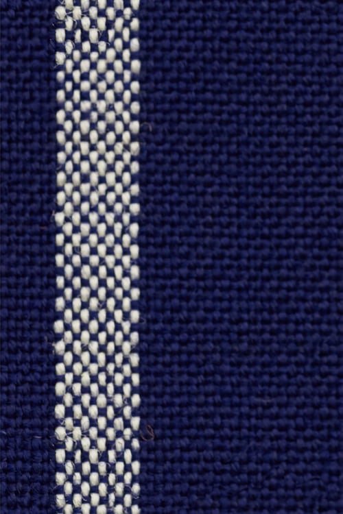 Close-up of a machine woven blue cloth with orange and white stripes