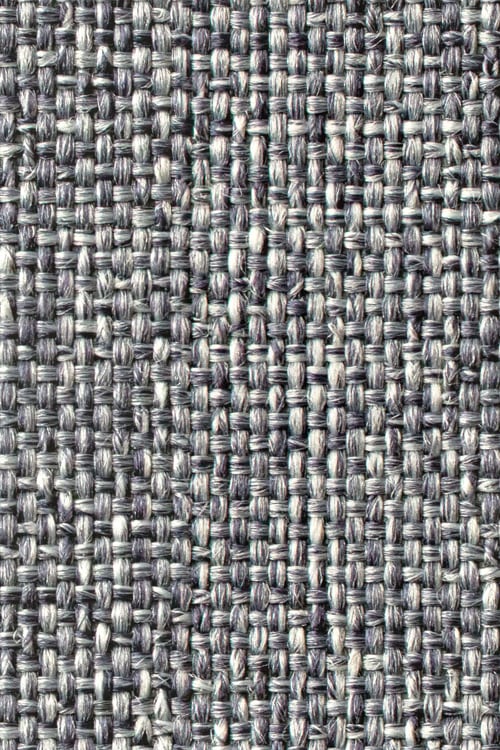 Close-up of a rough, dark, monocolor woven fabric