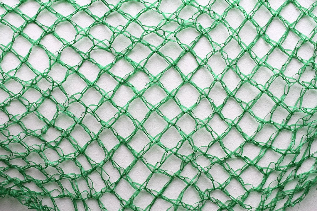 Green plastic net for potato packaging