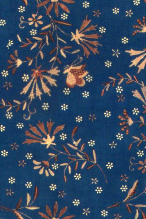 Close-up of a cloth with hip floral pattern on a dark blue background