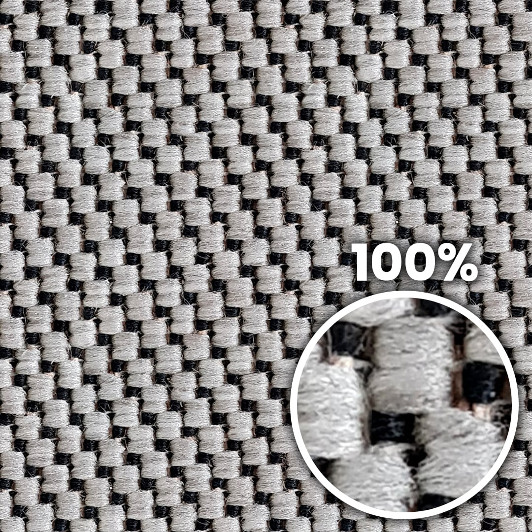 Tiling preview of a rough carpet with chunky black and mostly white fibers arranged in a zigzag pattern