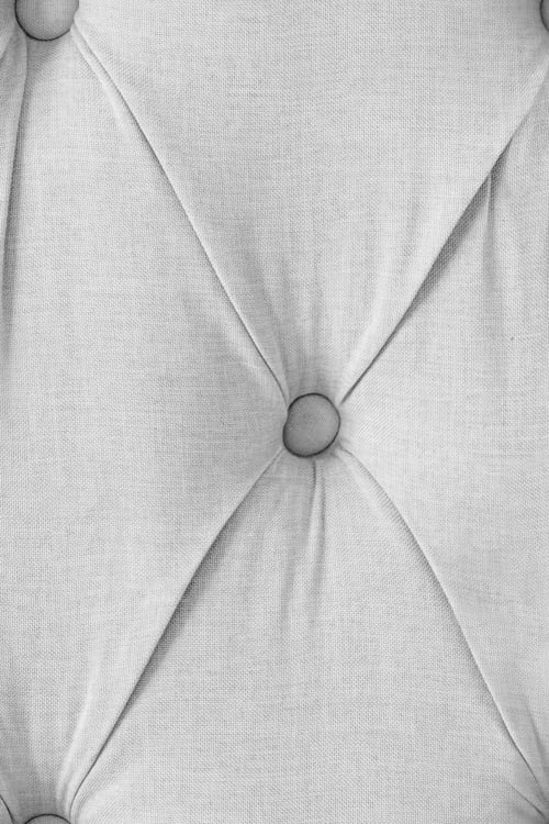 Close-up of a couch upholstery fabric with buttons