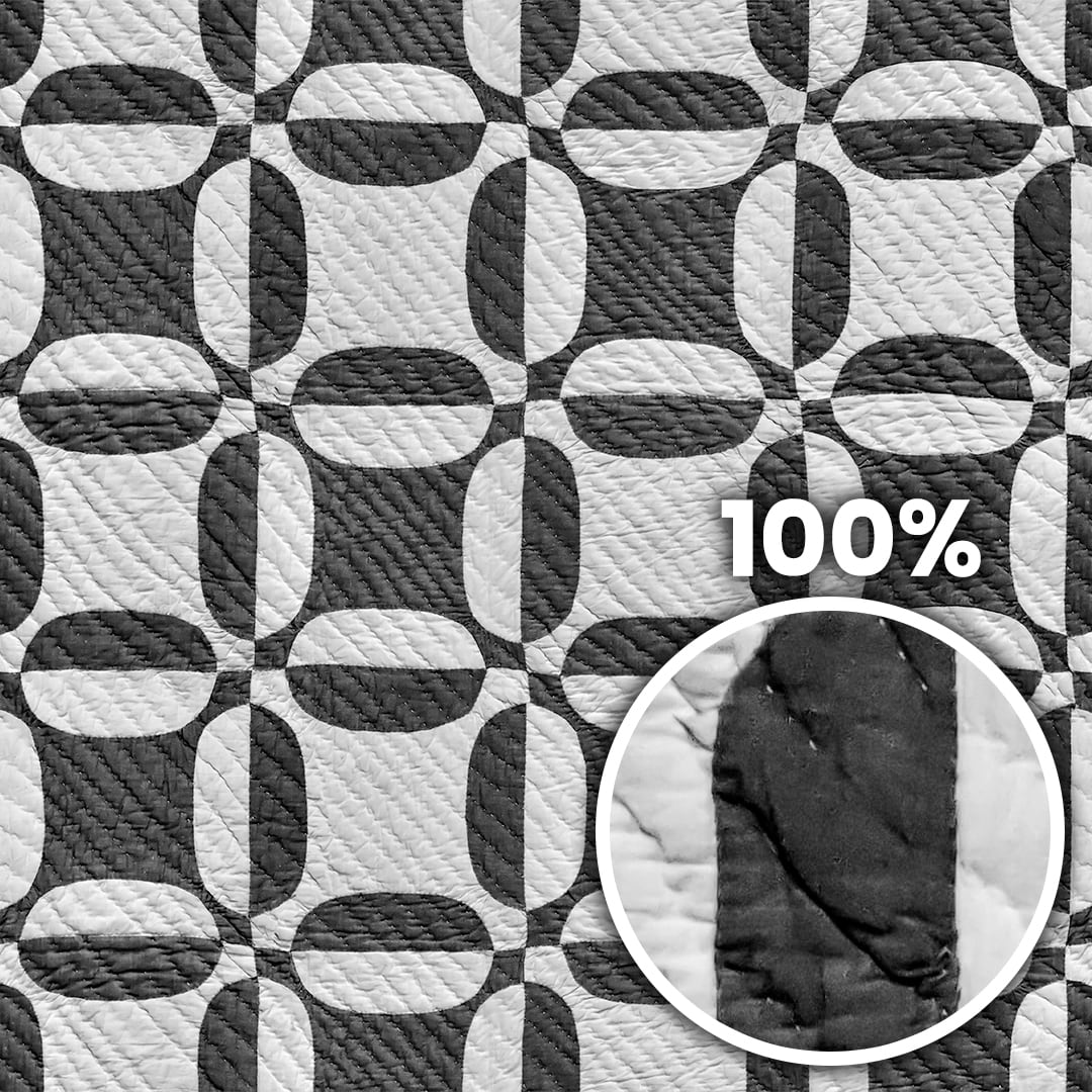 Tiling preview of a quilted duvet with geometric black and white pattern