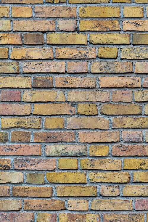 Ochre Brick Wall