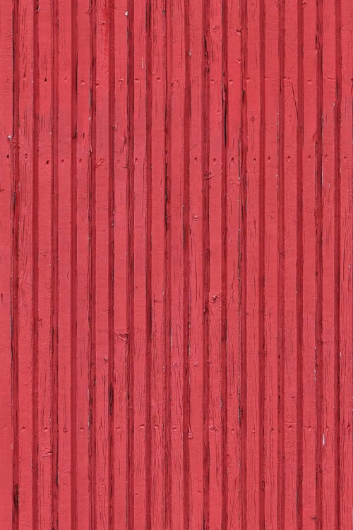 Exterior Wood Paneling with Red Flaking Paint