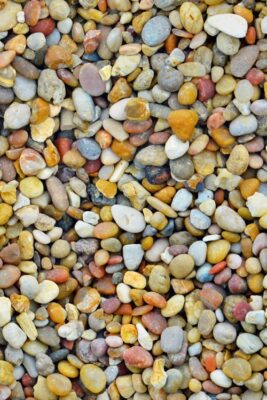 Warm Multicoloured Round Pebbles - Seamless Texture