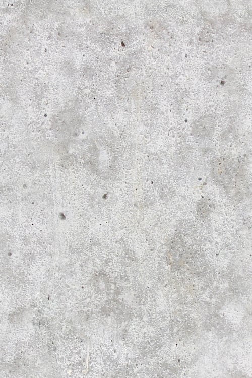 Close-up of a smooth concrete wall with porous surface
