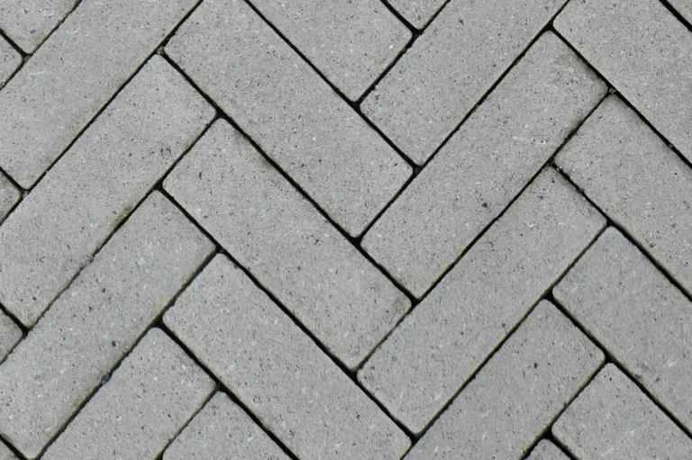 Close-up of a concrete brick tiled footpath arranged in a zigzag pattern