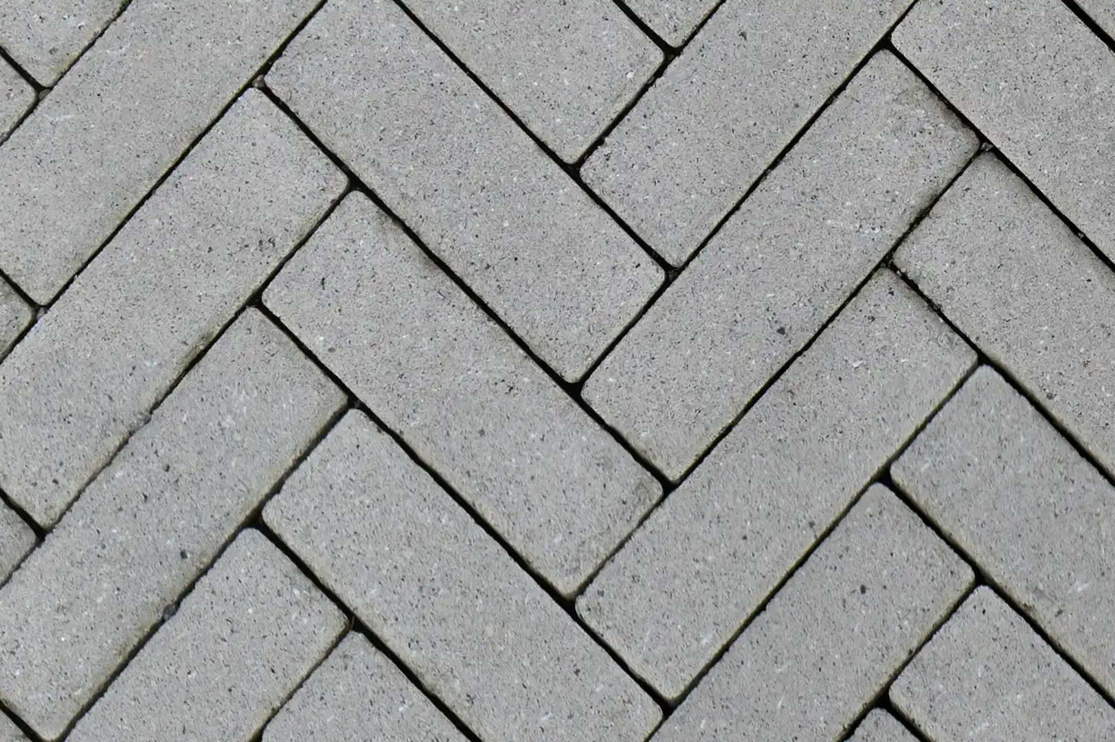 Close-up of a concrete brick tiled footpath arranged in a zigzag pattern