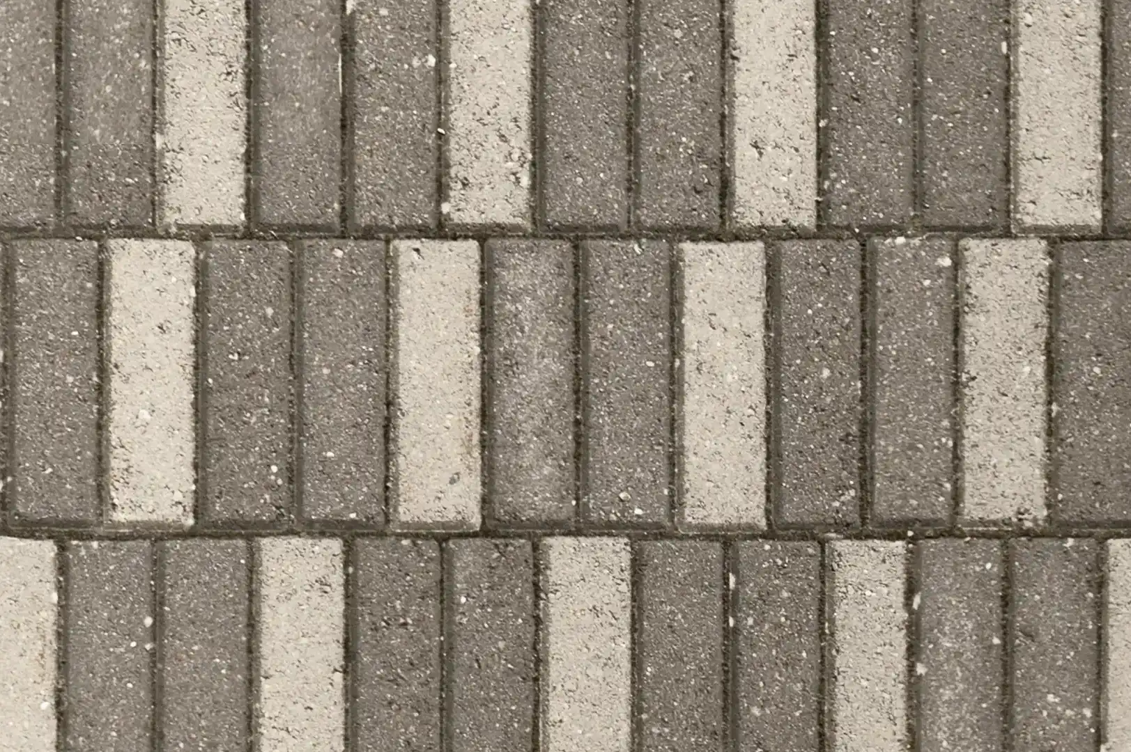 Close-up of a black & white rectangle concrete pavement sidewalk