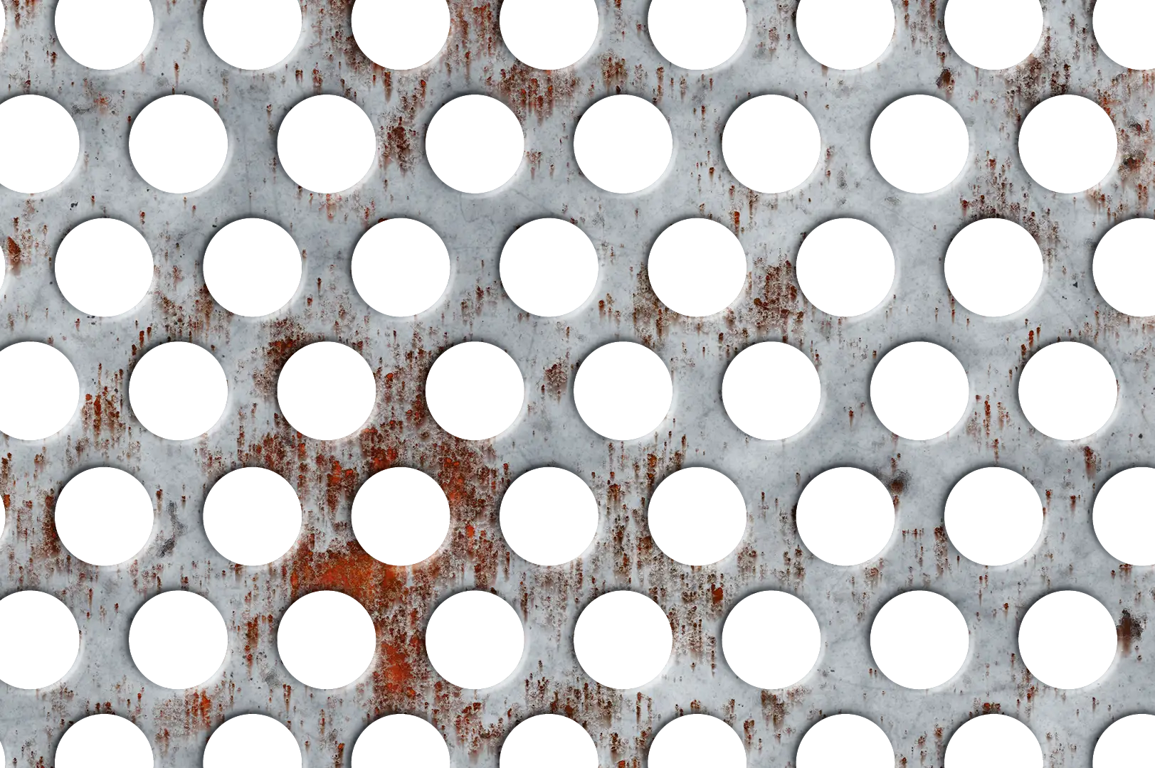 Close-up of a scratched, slightly rusty perforated metal panel with circular holes