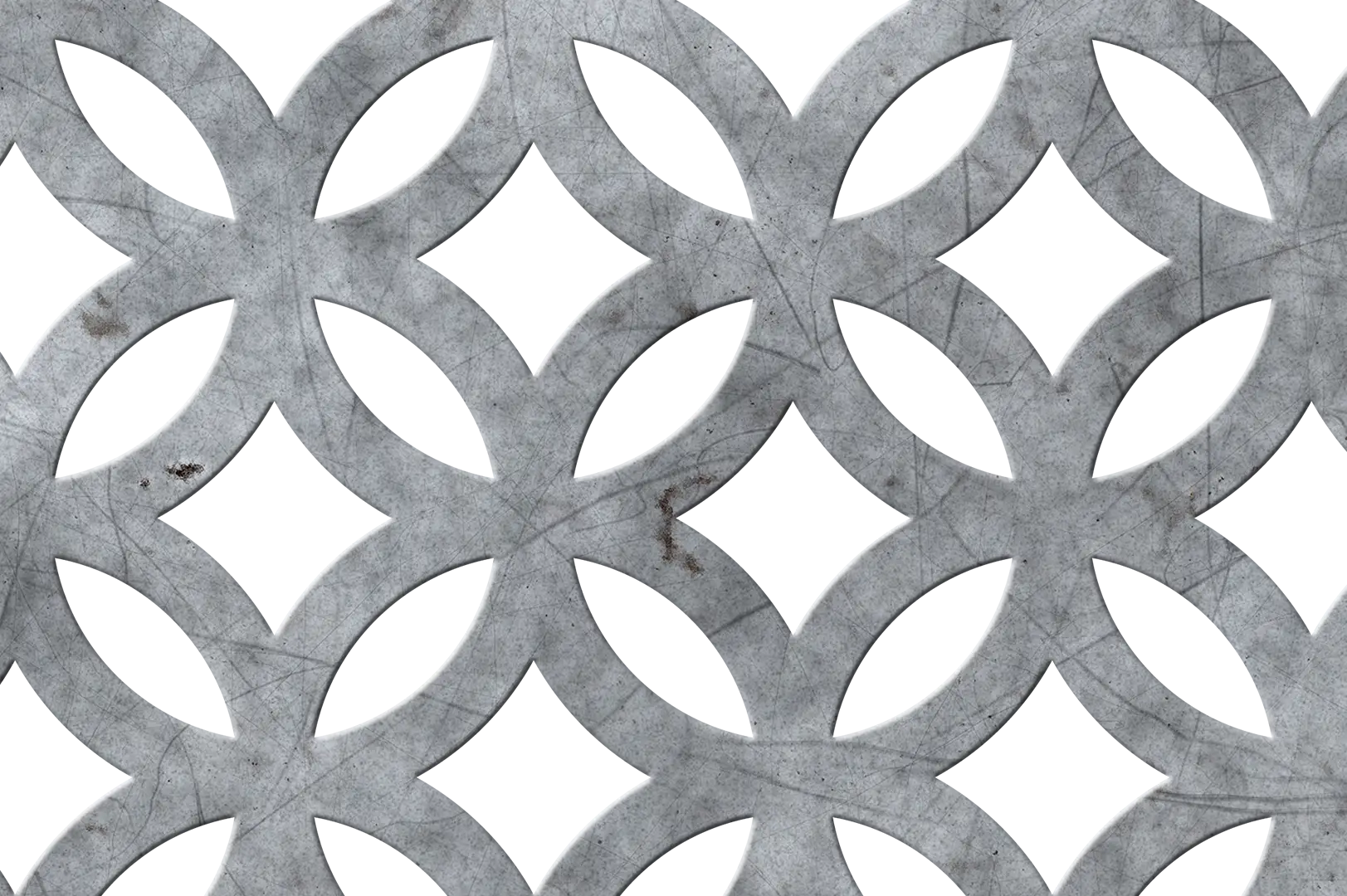 Close-up of a geometric perforated metal panel with light scratches on it