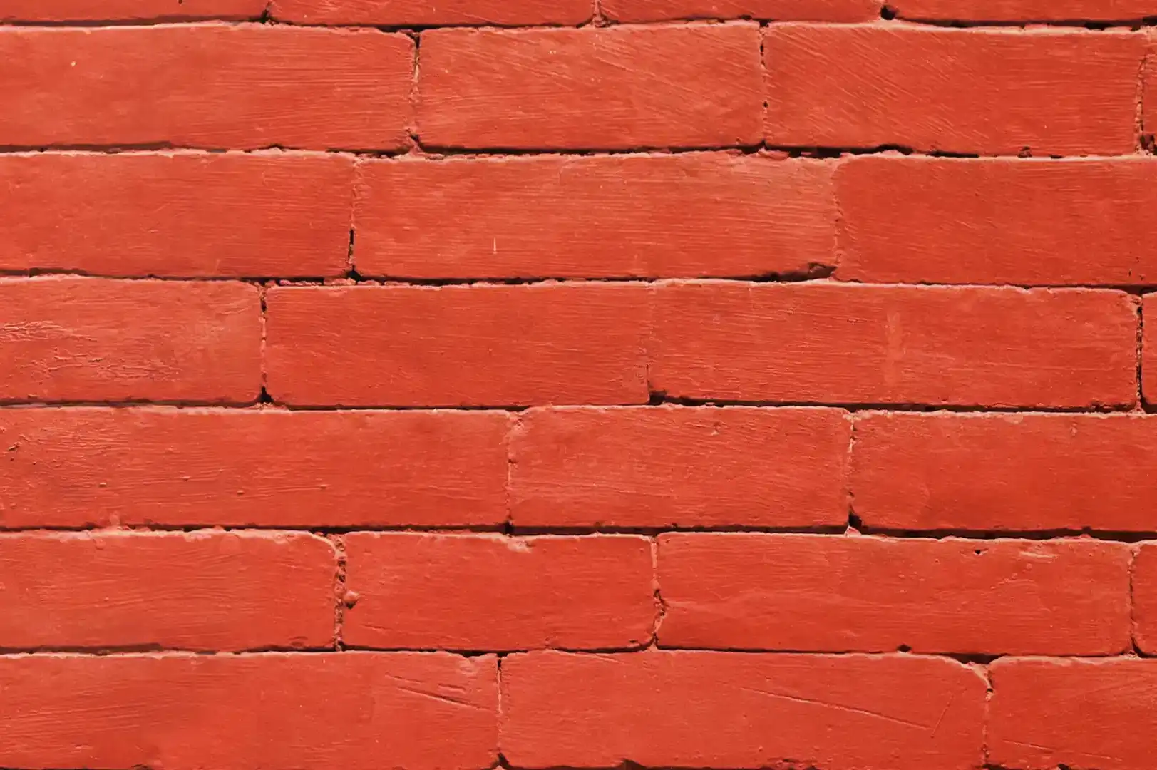 Close-up of a red painted brick wall