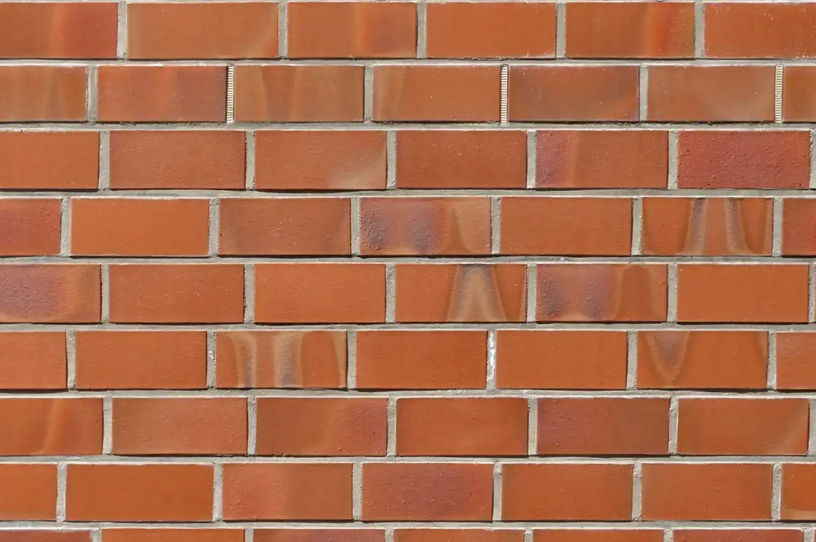 Close-up of a decorative orange brick wall