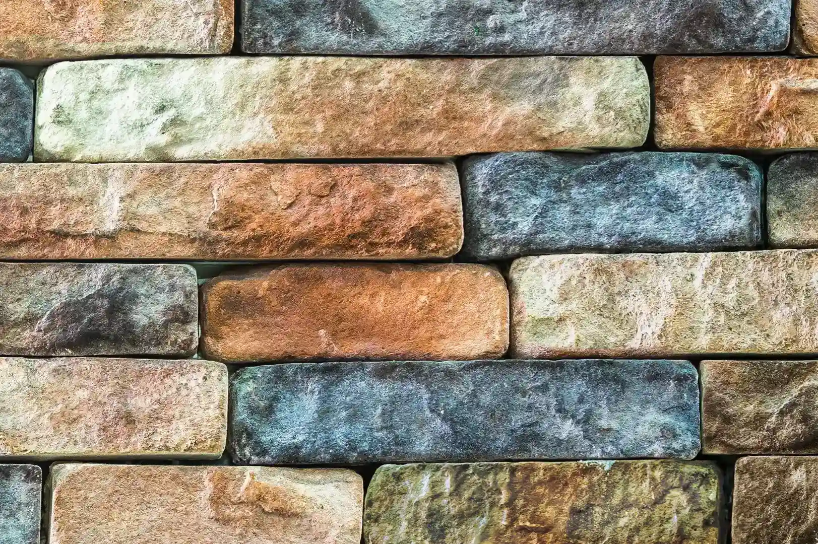 Close-up of a multicolored brick-like stone wall