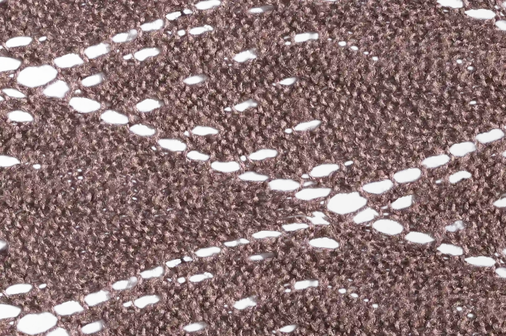 Close-up of a diamond pattern brown scarf with holes
