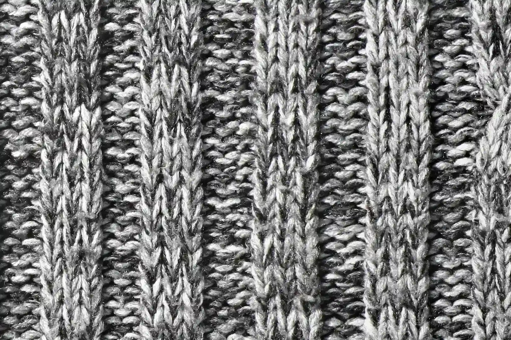 Close-up of an embossed knit sweater with black and white yarns