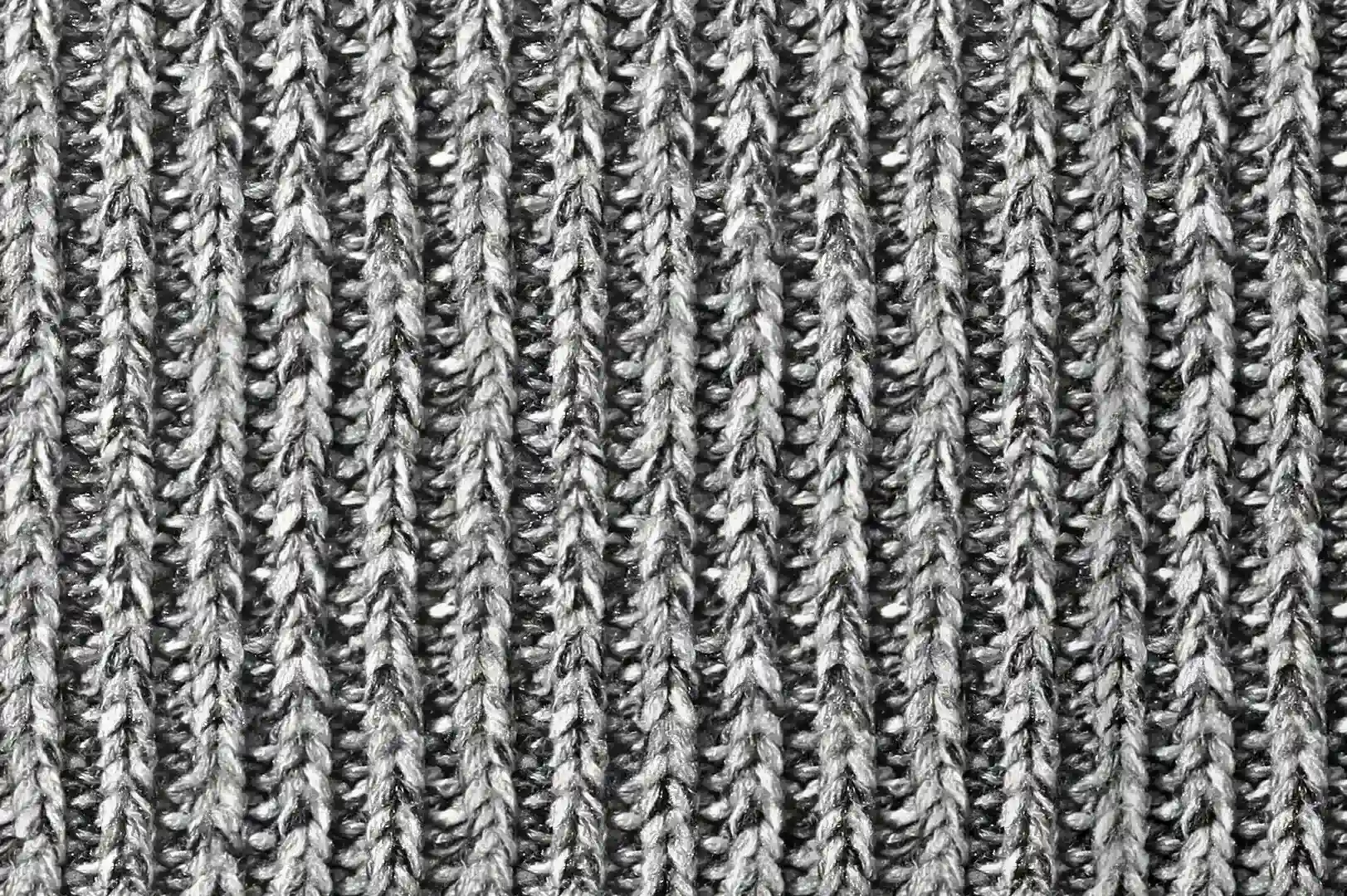 Close-up of an embossed knit sweater with black and white yarns