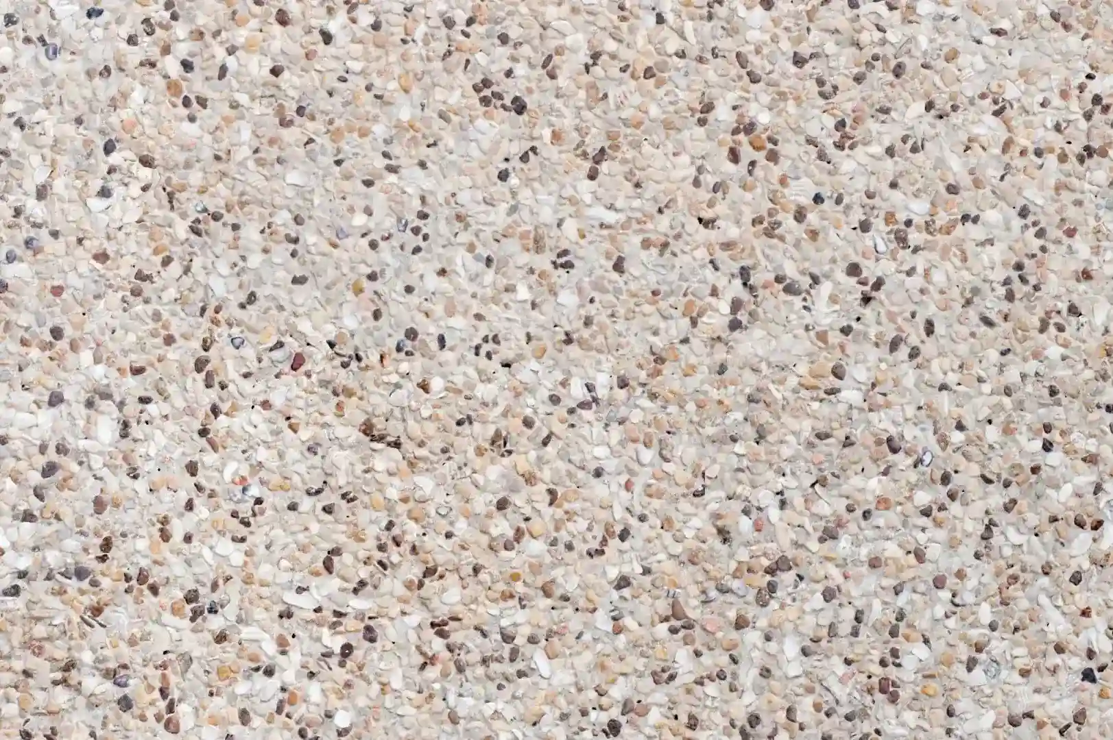 Close-up of a gravel decorated exterior plaster wall