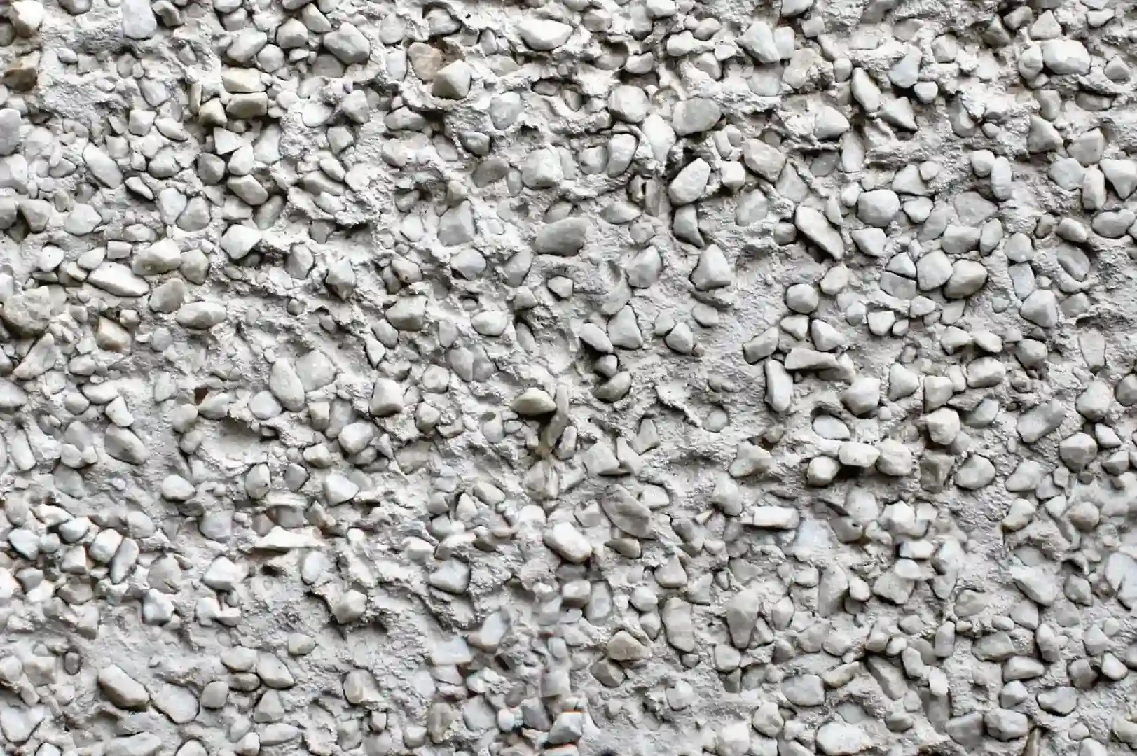 Close-up of a facade with cement plaster with fine gravel