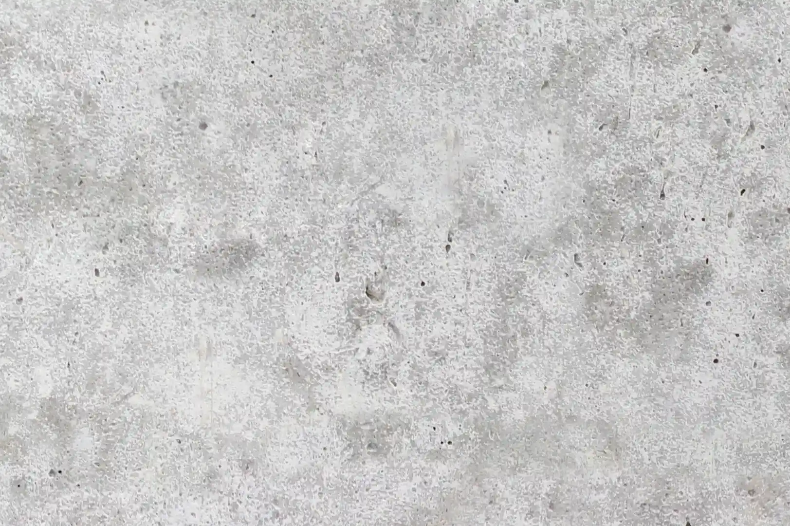 Close-up of a smooth concrete wall with porous surface