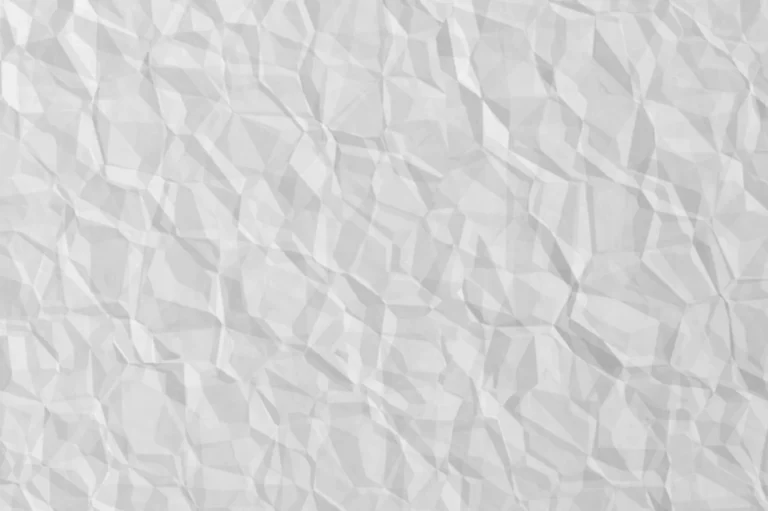 Close-up of a sheet of white creased paper