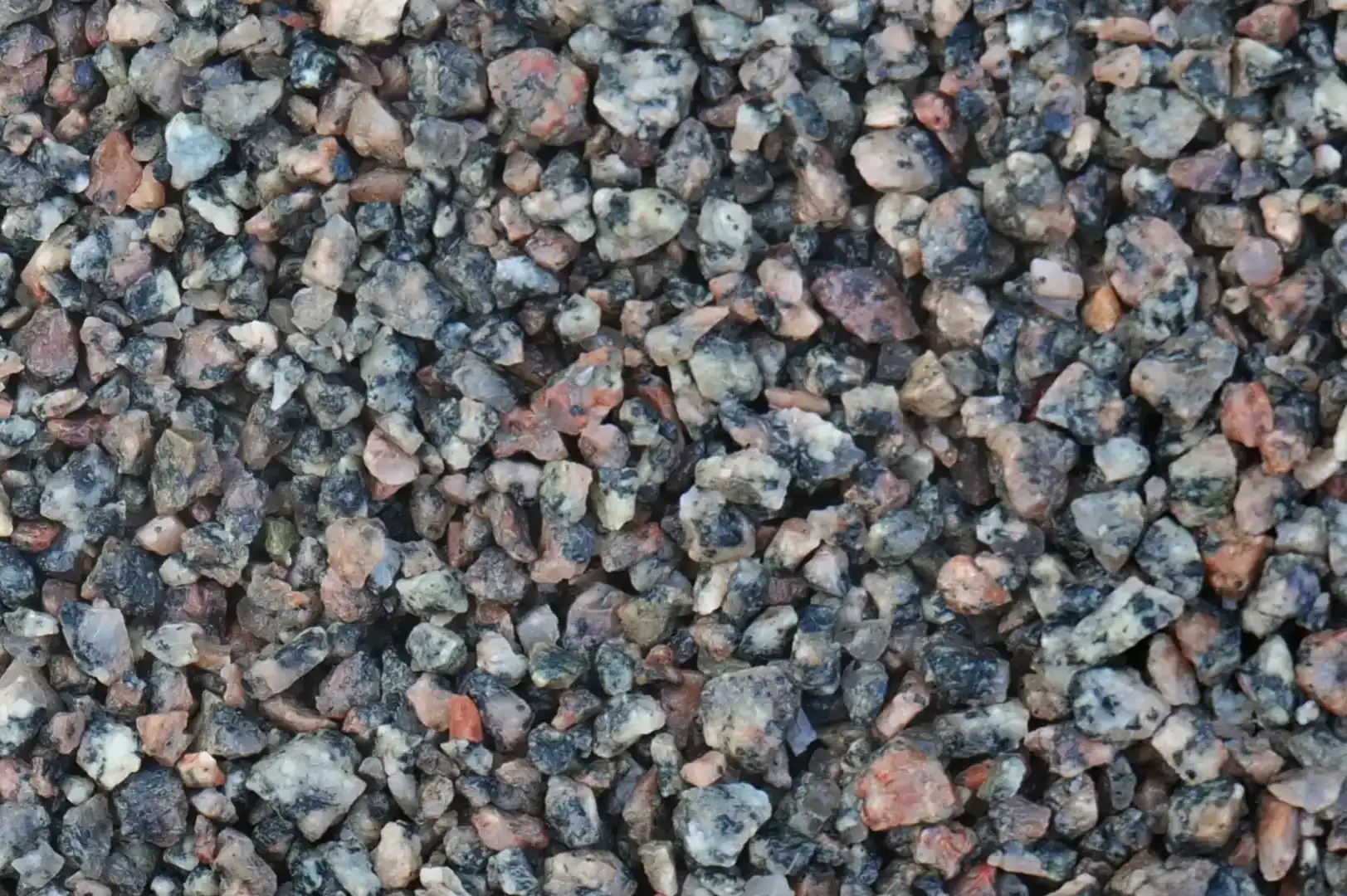 Close-up of a field with slightly wet coarse gravel