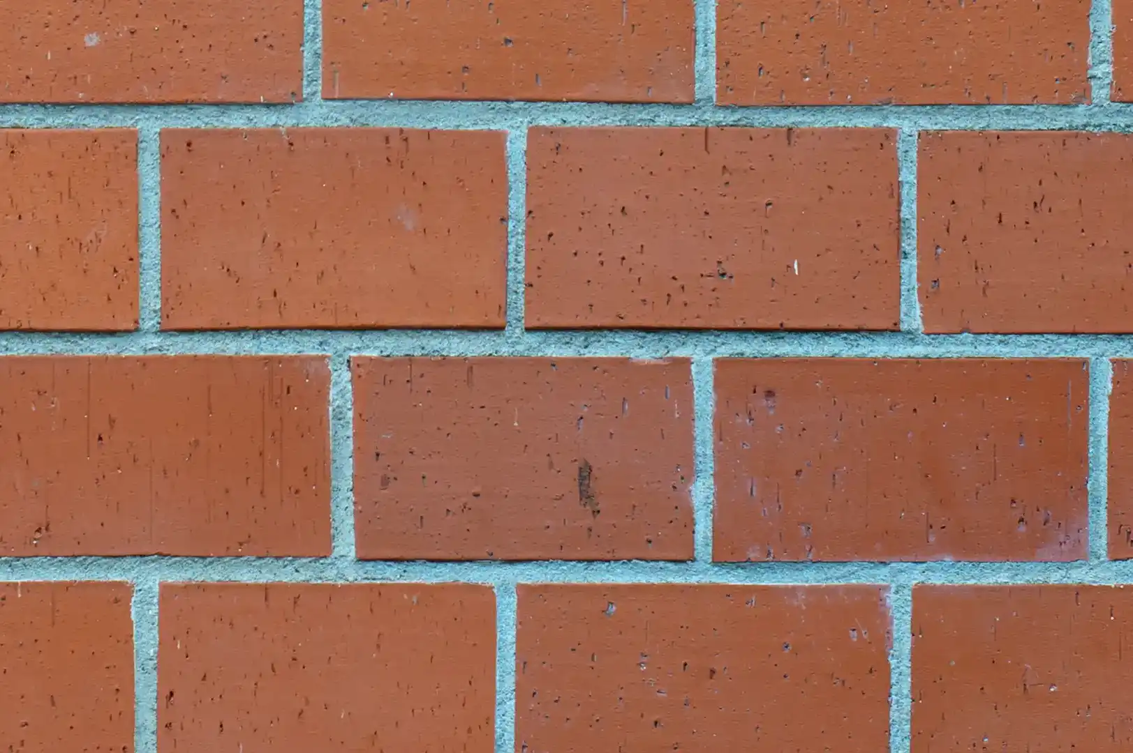 Close-up of a decorative brick wall with bigger and more squareish bricks