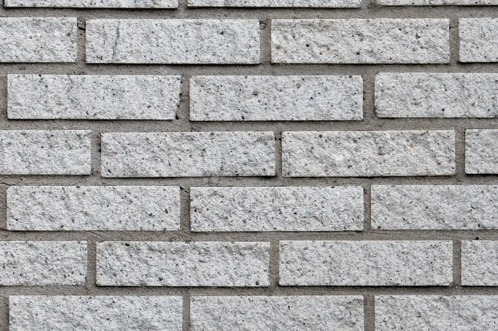 Close-up of a white stonelike decorative brick wall