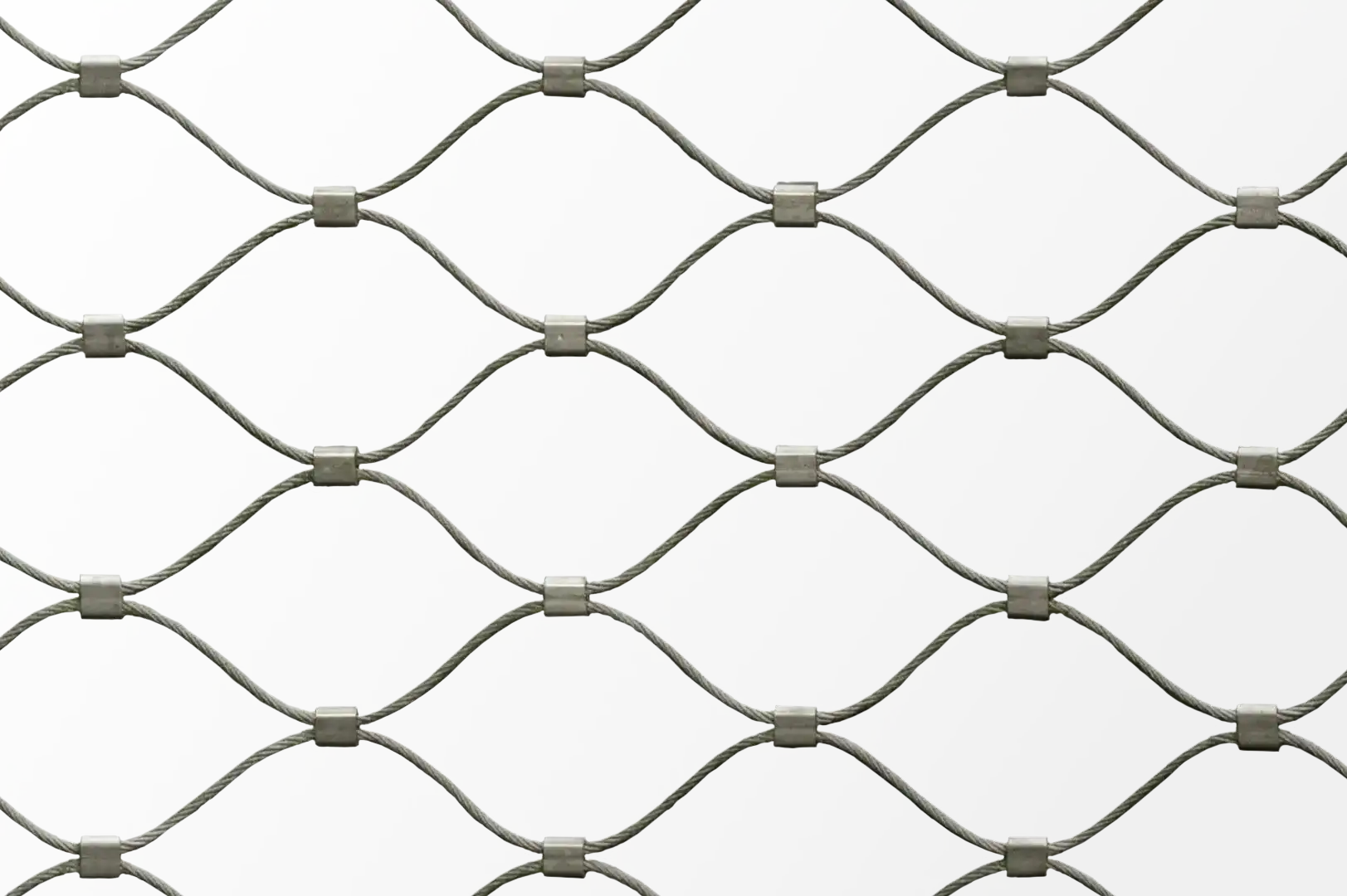 Close-up of a fence made of thin stainless steel wire rope