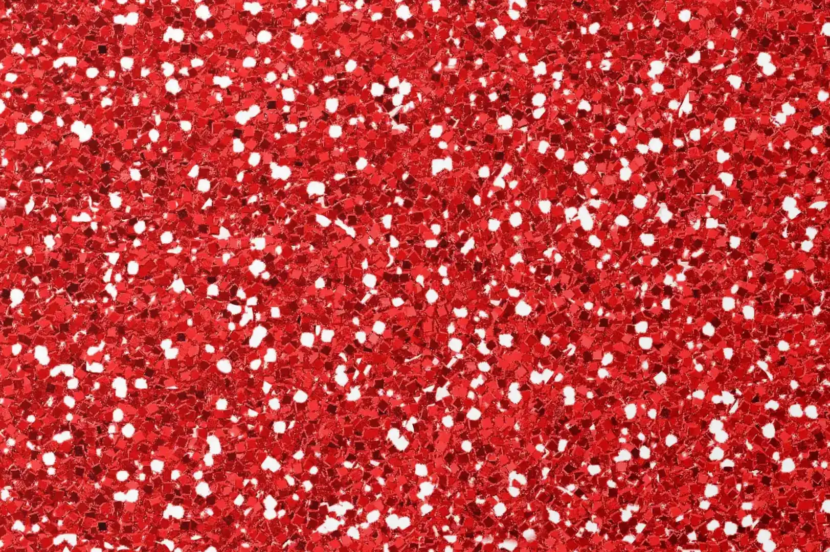Close-up of a red sparkling background with white grains