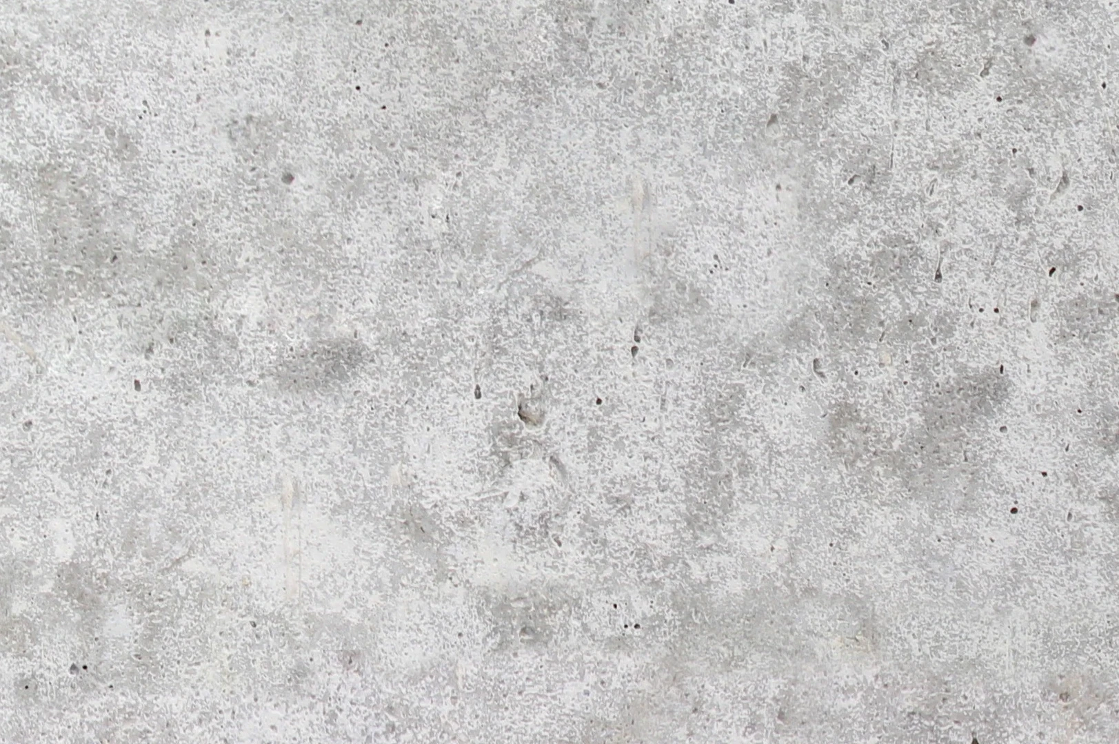 Close-up of a smooth concrete wall with porous surface