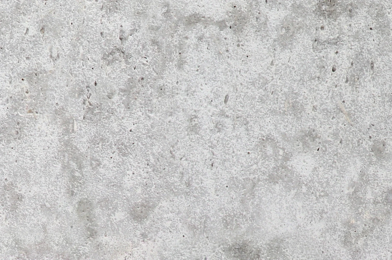 Close-up of a smooth concrete wall with porous surface