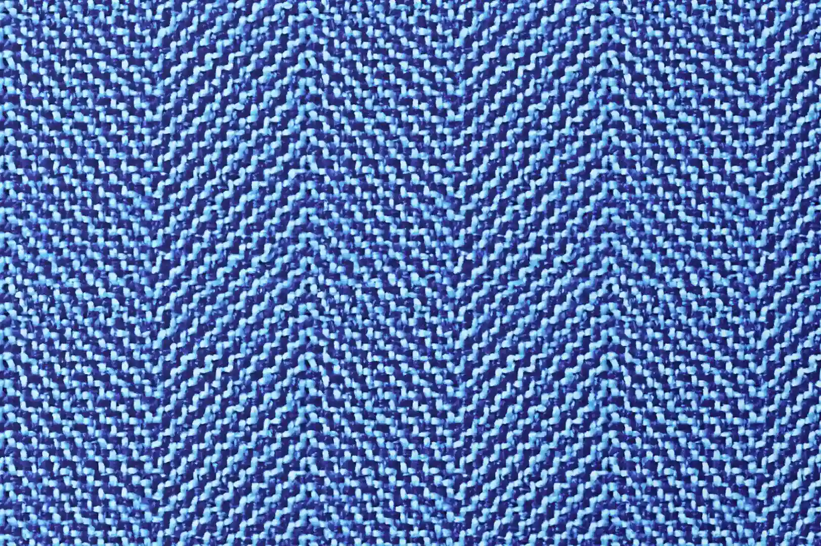 Close-up of a carpet with blue zigzag tweed