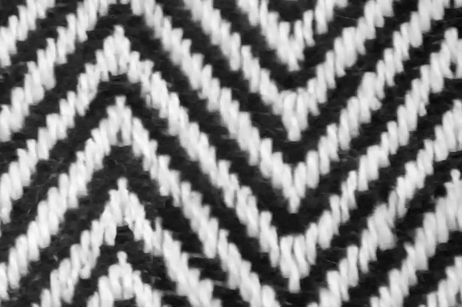 Close-up of a black and white fishbone zigzag patterned textile