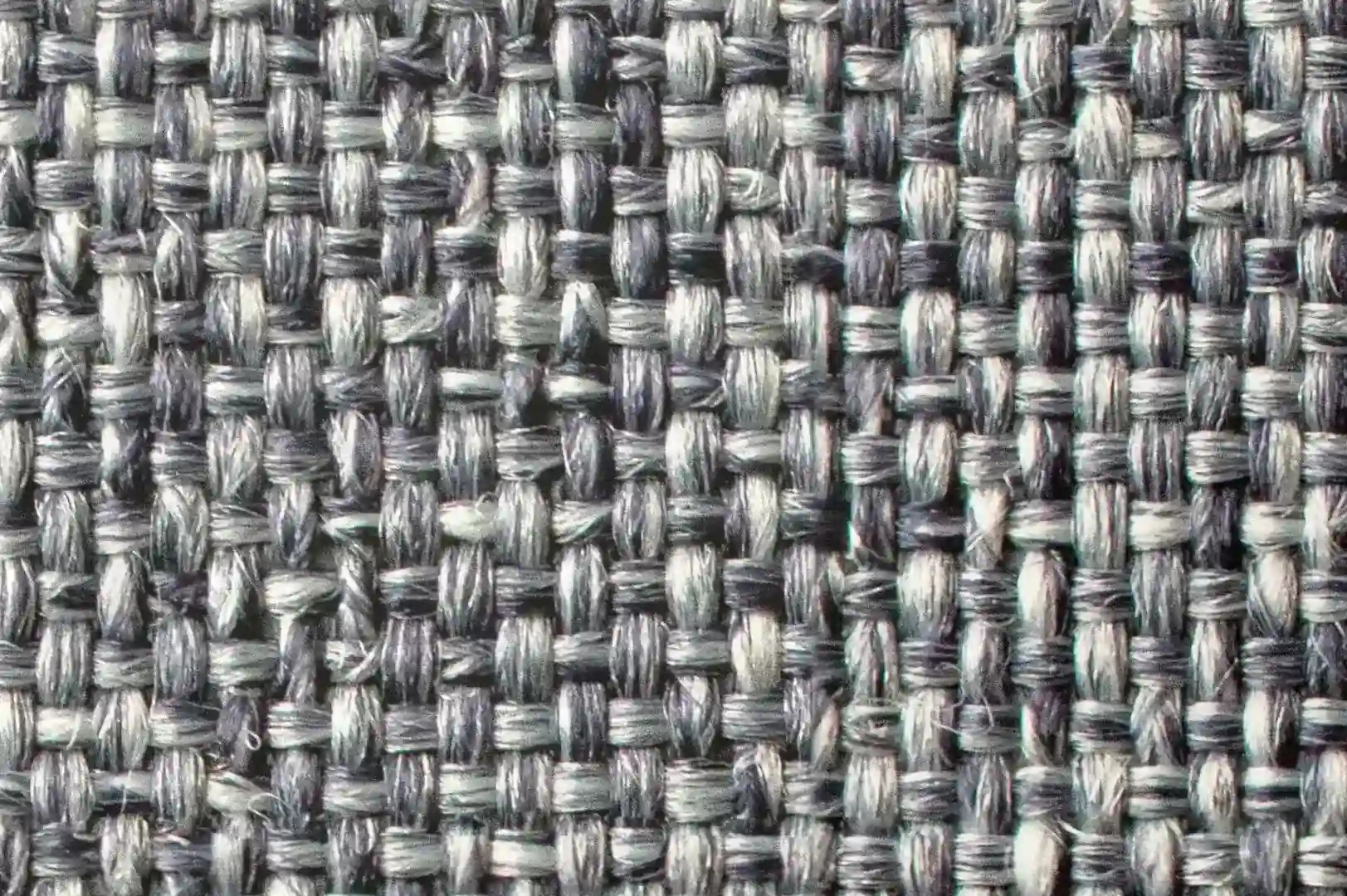 Close-up of a rough, dark, monocolor woven fabric