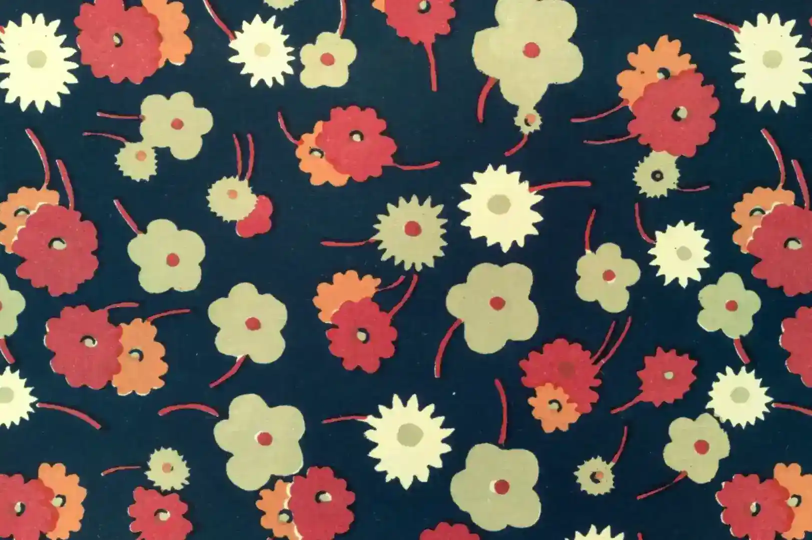 Close-up of a floral pattern of white, pink and red flowers on dark blue background
