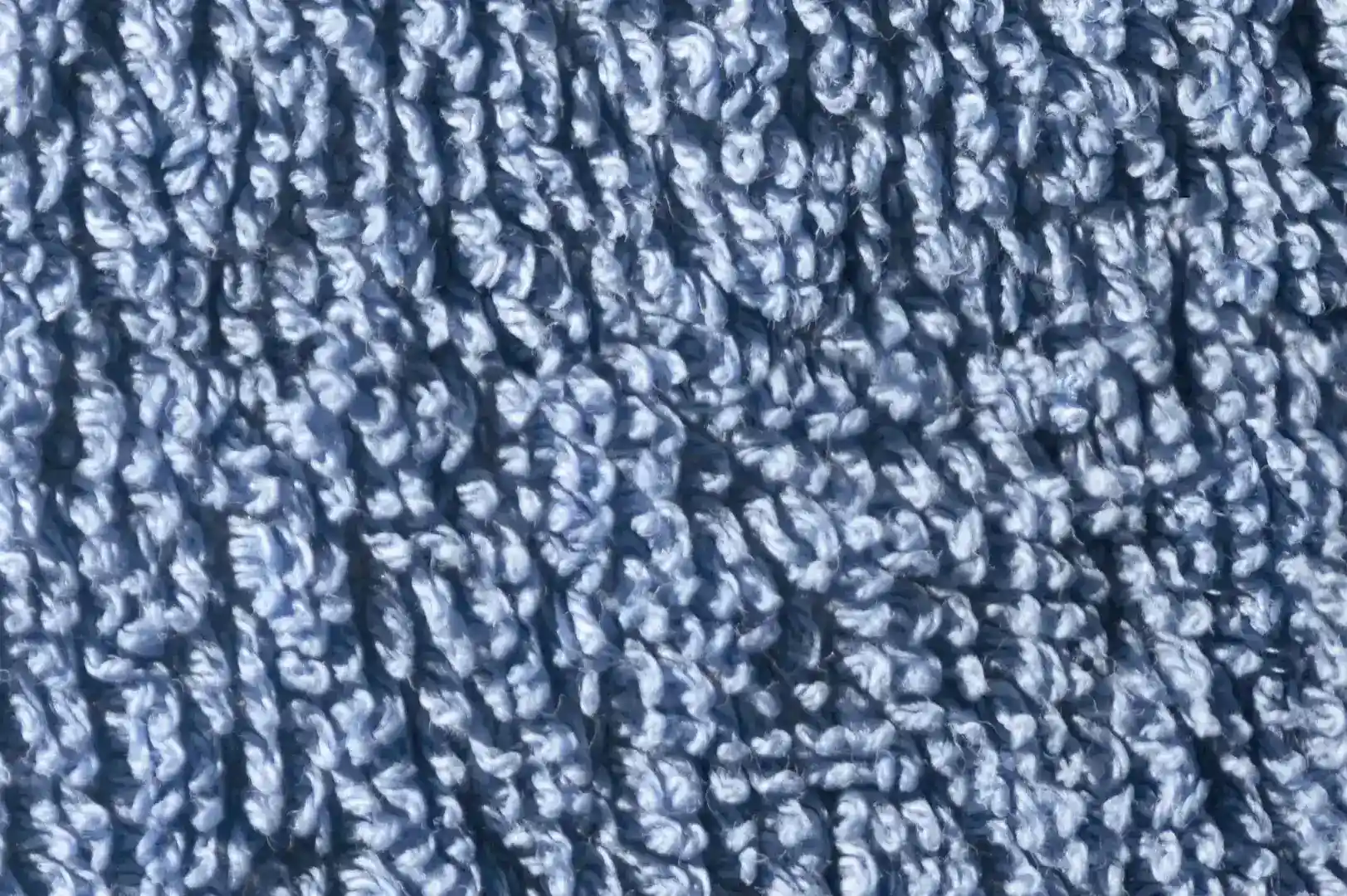 Close-up of a shaggy blue bath mat rug