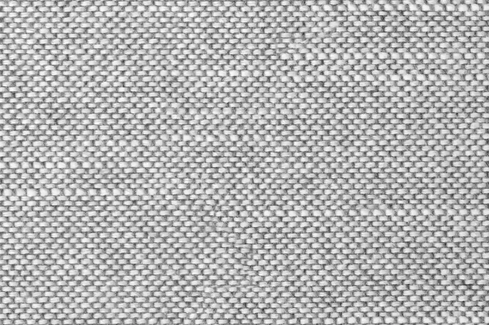 Close-up of a light grey woven tablecloth