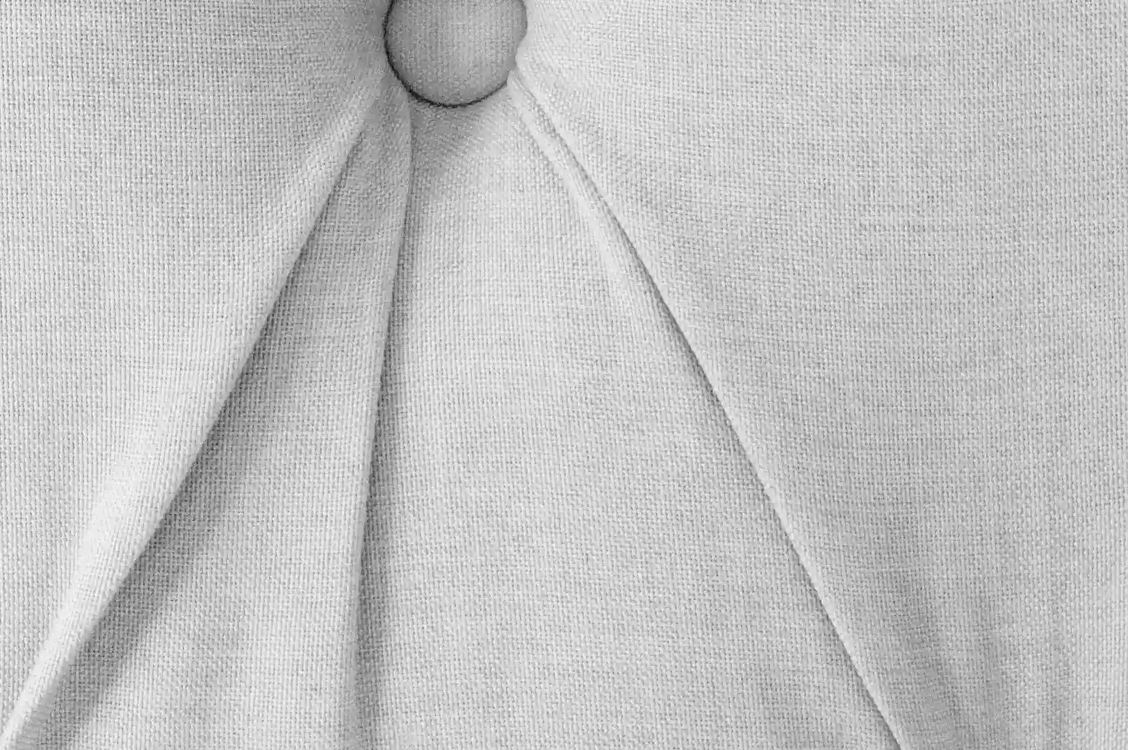 Close-up of a couch upholstery fabric with buttons