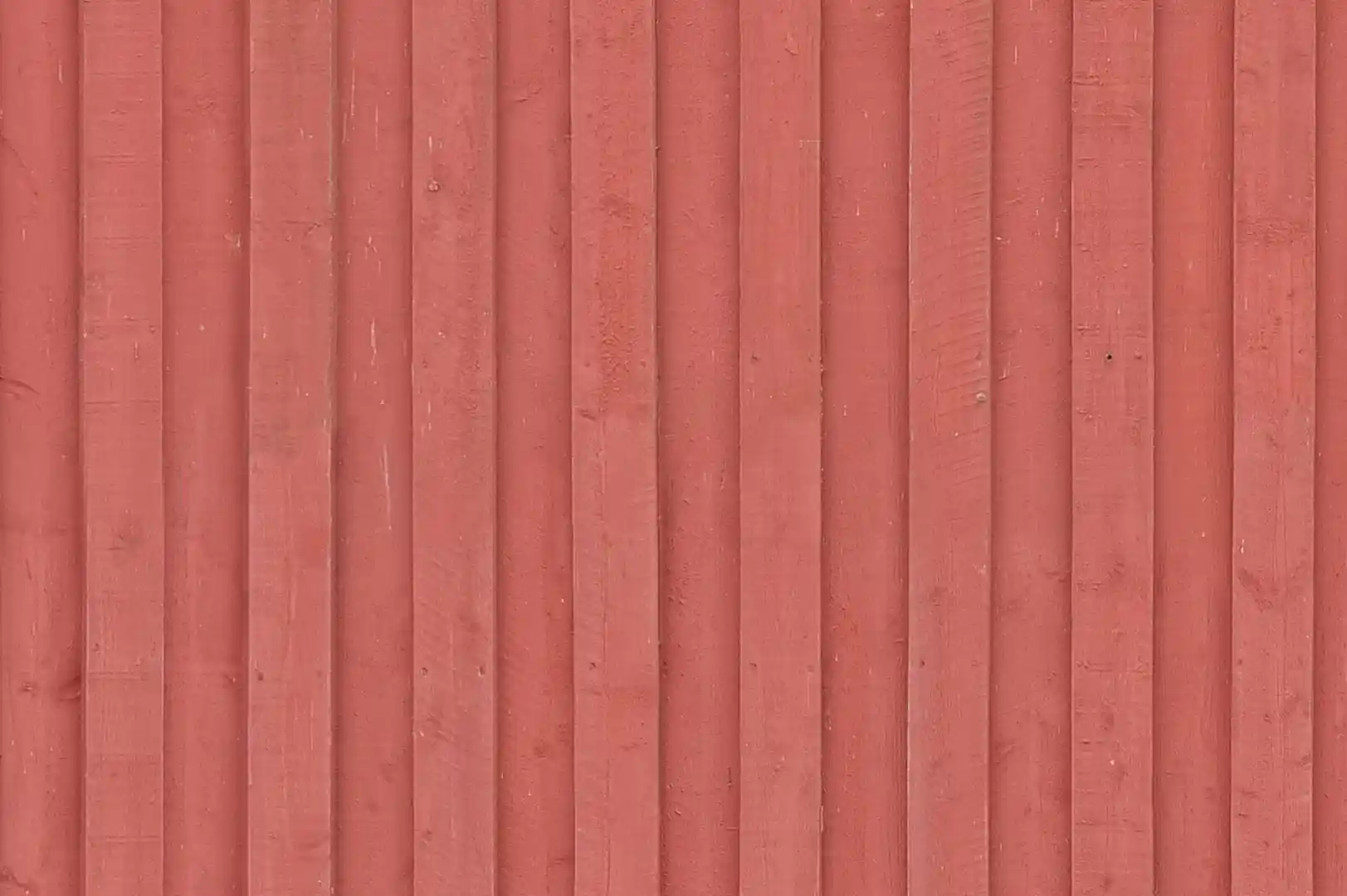 Close-up of a rough timber-clad exterior with overlapping planks